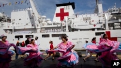 Venezuelan dancers welcome the arrival of Chinese navy hospital ship " The Peace Ark" docked at the port in la Guaira, Venezuela, Saturday, Sept. 22, 2018. (AP)