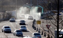 South Korean vehicles returning from North Korea's joint Kaesong Industrial Complex pass the customs, immigration and quarantine office near the border village of Panmunjom, that has separated the two Koreas since the Korean War, in Paju, South Korea, Jan. 7, 2016.