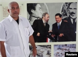 FILE - Cuban nurse Guillermo Ballines a day before his departure for Liberia during the Ebola crisis poses for a picture in Havana, Oct. 21, 2014.