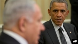 FILE - President Barack Obama listens as Israeli Prime Minister Benjamin Netanyahu speaks during their meeting in the Oval Office of the White House in Washington, Oct. 1, 2014.