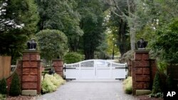 The gate is closed at the entrance to a house owned by philanthropist George Soros in Katonah, N.Y., a suburb of New York City, Oct. 23, 2018.