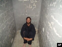 This image released by the Tribeca Film Festival shows Matthew VanDyke in a prison cell from the Marshall Curry film "Point and Shoot." The film won best documentary, April 24, 2014 at the Tribeca Film Festival in New York.