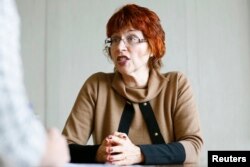 World Health Organization's Flavia Bustreo gestures during an interview in Geneva, Feb. 15, 2016.