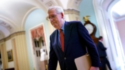 Senate Minority Leader Mitch McConnell, R-Ky., walks to the chamber for a test vote on a government spending bill, at the Capitol in Washington, Sept. 27, 2021.