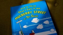 FILE - A copy of the book "And to Think That I Saw It on Mulberry Street," by Dr. Seuss, rests in a chair, Monday, March 1, 2021, in Walpole, Mass. (AP Photo/Steven Senne)