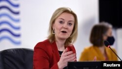 FILE: British Foreign Secretary Liz Truss speaks during a G-7 foreign and development ministers session with guest countries and ASEAN nations in Liverpool, Britain, Dec. 12, 2021.
