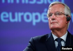 European Union's chief Brexit negotiator Michel Barnier delivers a statement after Britain's Prime Minister Theresa May's cabinet meeting, in Brussels, Belgium, Nov. 14, 2018.