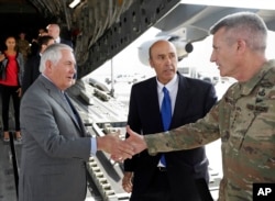 Secretary of State Rex Tillerson is greeted by Gen. John Nicholson, right, commander of Resolute Support, with Special Charge d'Affaires Amb. Hugo Llorens, as he arrives, Oct. 23, 2017, at Bagram Air Base, Afghanistan.