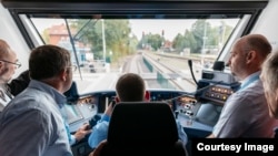 Officials ride the new Coradia iLint hydrogen-powered train that recently launched in northern Germany. (René Frampe/Alstom)