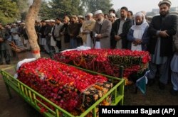 A funeral prayer for a student killed in the Taliban attack on a school in Peshawar, Pakistan, Wednesday, Dec. 17, 2014