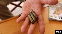 Martin Evans, owner of Ol Maisor ranch, shows shell casings he found on his property in Laikipia, Kenya, March 16, 2017. (J. Craig/VOA)