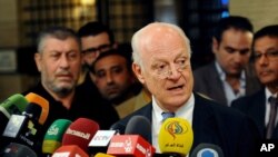 In this photo released by the Syrian official news agency SANA, United Nations special envoy to Syria Staffan de Mistura, speaks during a press conference in Damascus, Syria, Tuesday, Nov. 11, 2014.