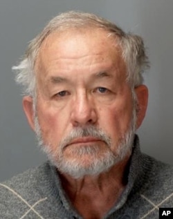 This booking photo provided by the Michigan Attorney General's Office on Tuesday, March 27, 2018, shows William Strampel.