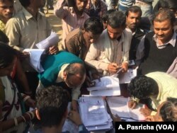 Bank official C.R. Khobba says they expect to open 150 to 200 accounts in a single day at a temporary camp for workers.