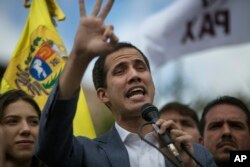 Venezuela's self-declared interim leader Juan Guaido speaks to supporters in a public plaza in Las Mercedes neighborhood of Caracas, Venezuela, Jan. 26, 2019.