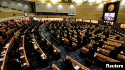 Members of the National Legislative Assembly take part in a meeting as Thailand's parliament is set to announce that Crown Prince Maha Vajiralongkorn is to ascend the throne