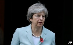 Britain's Prime Minister Theresa May leaves 10 Downing Street for the House of Commons in Parliament in London, Monday, Oct. 30, 2017.