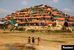 FILE - Rohingya refugee children play at the Palongkhali refugee camp near Cox's Bazar, Bangladesh, Dec. 22, 2017.