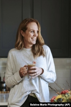 This image released by Saleina Marie Photography shows Marnie Rae Clark drinking a mocktail.