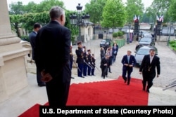 French Foreign Minister Jean-Marc Ayrault, left, welcomes U.S. Secretary of State John Kerry at the Quai d'Orsay -- the French Foreign Ministry -- in Paris, France, before a bilateral meeting, June 4, 2016.