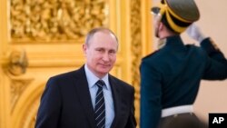 FILE - Russian President Vladimir Putin arrives to chair a meeting, in Moscow's Kremlin, Russia, April 5, 2016.