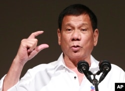 FILE - Philippine President Rodrigo Duterte delivers a speech at the Philippine Economic Forum in Tokyo, Oct. 26, 2016.