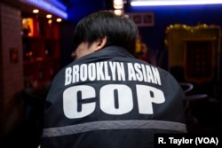 Hongmiao Yu, a volunteer with BACOP, says his young daughter likes seeing him come home in uniform. “It makes me very proud,” Yu said.