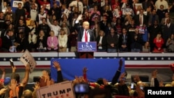 FILE - U.S. President-elect Donald Trump speaks at a rally as part of their "USA Thank You Tour 2016" in Cincinnati, Ohio, Dec. 1, 2016.