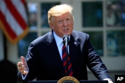 FILE - President Donald Trump speaks about modernizing the immigration system in the Rose Garden of the White House, in Washington, May 16, 2019.
