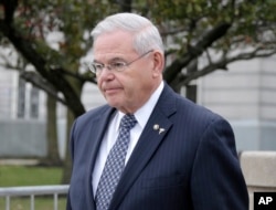 Democratic U.S. Sen. Bob Menendez leaves the federal courthouse in Newark, New Jersey, Nov. 13, 2017.