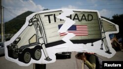 FILE - Protesters attend an anti-THAAD proest in Seongju, South Korea,June 14, 2017.