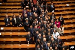 Delegates leave after the closing session of the Chinese People's Political Consultative Conference (CPPCC) at the Great Hall of the People in Beijing, March 13, 2019.