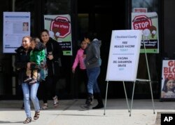Signs advertising free measles vaccines and information about measles are displayed at the Rockland County Health Department in Pomona, New York, March 27, 2019.