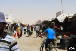 More than 80,000 people now live in the Za'atari camp in Jordan, and many say social media is their main source of news and communication with their families and friends still trapped in the war zones. (Credit: VOA/Heather Murdock)