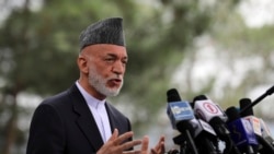 Afghanistan's former President Hamid Karzai speaks during a news conference in Kabul, Afghanistan, Tuesday, July 13, 2021. Former President Karzai calls on both the Afghan government and the Taliban to recontinue negotiations and end fighting in the country. (AP Photo/Rahmat Gul)