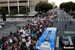 Supporters of the Deferred Action for Childhood Arrivals program march to City Hall in Los Angeles, Sept. 5, 2017.