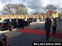 German Chancellor Angela Merkel, right, greets U.S. President Barack Obama at the stately Schloss Herrenhausen, once the summer residence of the Royal House of Hannover, April 24, 2016.