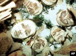 Ogiek warriors gather in a forest in western Kenya