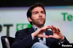FILE - Jeff Weiner, CEO of LinkedIn, speaks on stage at the TechCrunch Disrupt SF 2013 technology conference in San Francisco, California, Sept. 9, 2013.