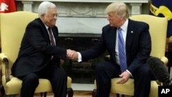 FILE - President Donald Trump shakes hands with with Palestinian leader Mahmoud Abbas during their meeting in the Oval Office of the White House, May 3, 2017, in Washington.