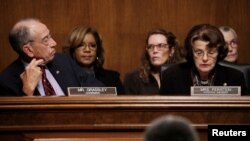 FILE- Senate Judiciary Committee Chairman Chuck Grassley (R-IA) looks over at ranking member Sen. Dianne Feinstein (D-CA) as members of the Senate Judiciary Committee meet to vote on the nomination of judge Brett Kavanaugh.