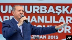 FILE - Turkey's President Recep Tayyip Erdogan addresses an election rally ahead of June general elections, in Ardahan, Turkey, June 6, 2015.