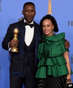 Mahershala Ali, left, winner of the award for best performance by an actor in a supporting role in any motion picture for "Green Book," and Amatus Sami-Karim pose in the press room at the 76th annual Golden Globe Awards