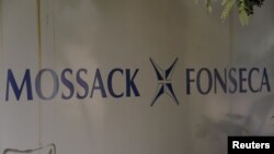 FILE - The Mossack Fonseca law firm logo is seen on a wall in Panama City, April 3, 2016. The allegations against Messi surfaced as part of a massive data leak of more than 11.5 million documents from the Panama-based law firm.