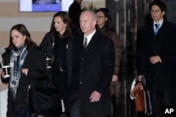 Deputy U.S. Trade Representative Jeffrey D. Gerrish, center, and members of his delegation leave the Westin hotel in Beijing, China, Jan. 7, 2019, for talks with their Chinese counterparts.