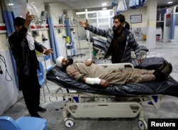 An Afghan injured man receives treatment at a hospital after a car bomb blast in Kabul, Afghanistan, Jan. 14, 2019.