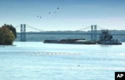 A more placid Mississippi at the Interstate Highway 74 bridge connecting Davenport with Illinois.