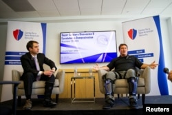 Keith Maxwell, Senior Product Manager of Exoskeleton Technologies at Lockheed Martin, right, speaks alongside Paul Scharre, Senior Fellow and Director of the Technology and National Security Program at the Center for a New American Security.