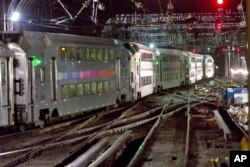 FILE - A New Jersey Transit train traverses the tracks in New York's Penn Station, July 25, 2017. President Donald Trump opposes funding for a Hudson River tunnel and rail project that's important to Senate Minority Leader Chuck Schumer, a New York Democrat, and Republicans from New York and New Jersey.