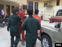 FILE - Australian filmmaker James Ricketson, who is accused of espionage, appears at the Supreme Court in Phnom Penh, Jan. 17, 2018.